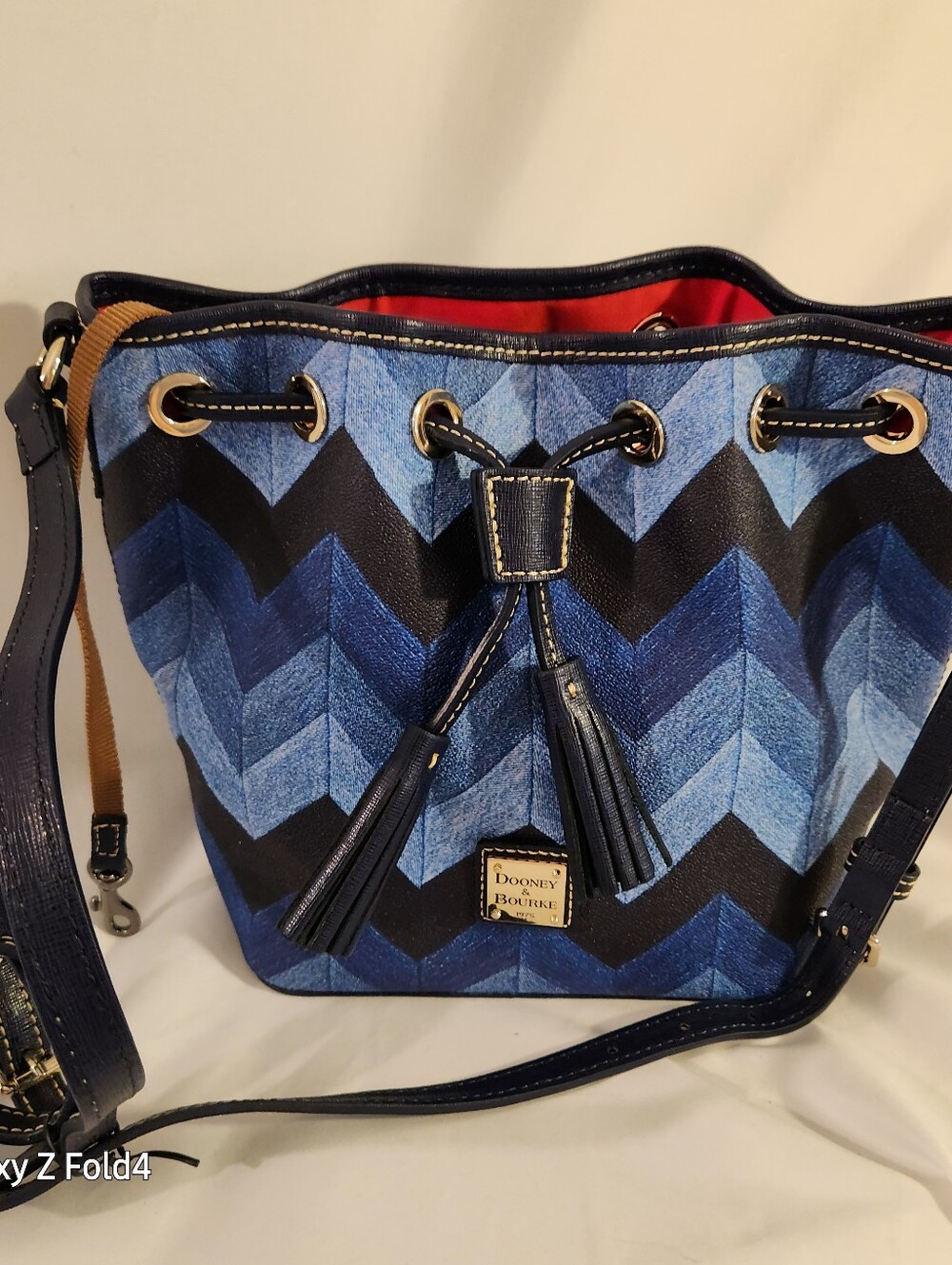 Dooney & Bourke Blue Chevron Drawstring Crossbody Bag with Tassels